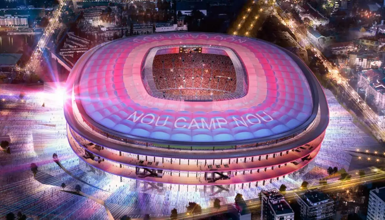 Nocny widok na Camp Nou, jeden z najnowocześniejszych stadionów w Hiszpanii, oświetlony w barwach klubu.