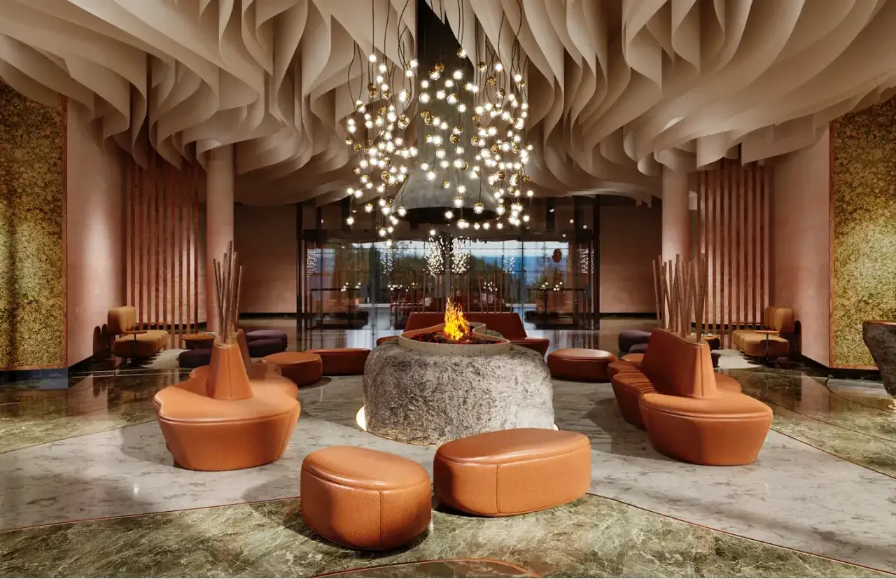 Nowoczesne wnętrze hotelu Four Seasons z paleniskiem i designerskimi meblami.