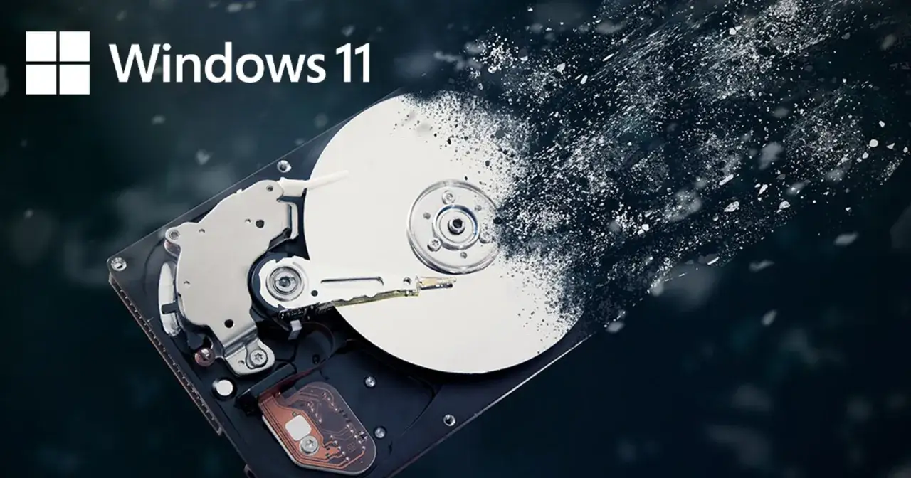 Windows 11 i rozpadający się dysk twardy, symbolizujący defragmentację dysku i optymalizację systemu.