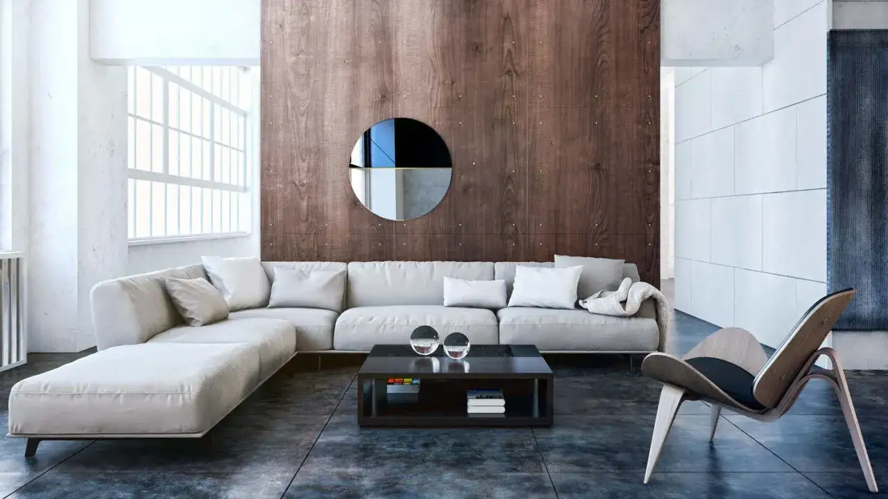Nowoczesny salon w stylu bauhaus z szarą sofą, drewnianą ścianą i designerskim fotelem.