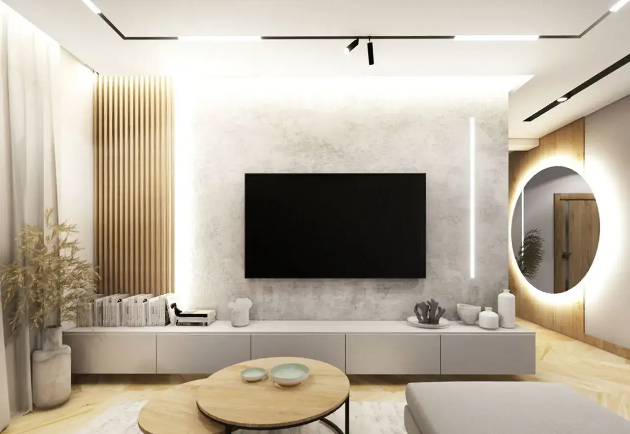 Nowoczesny salon z betonową ścianą, drewnianymi lamelami i okrągłym lustrem.
