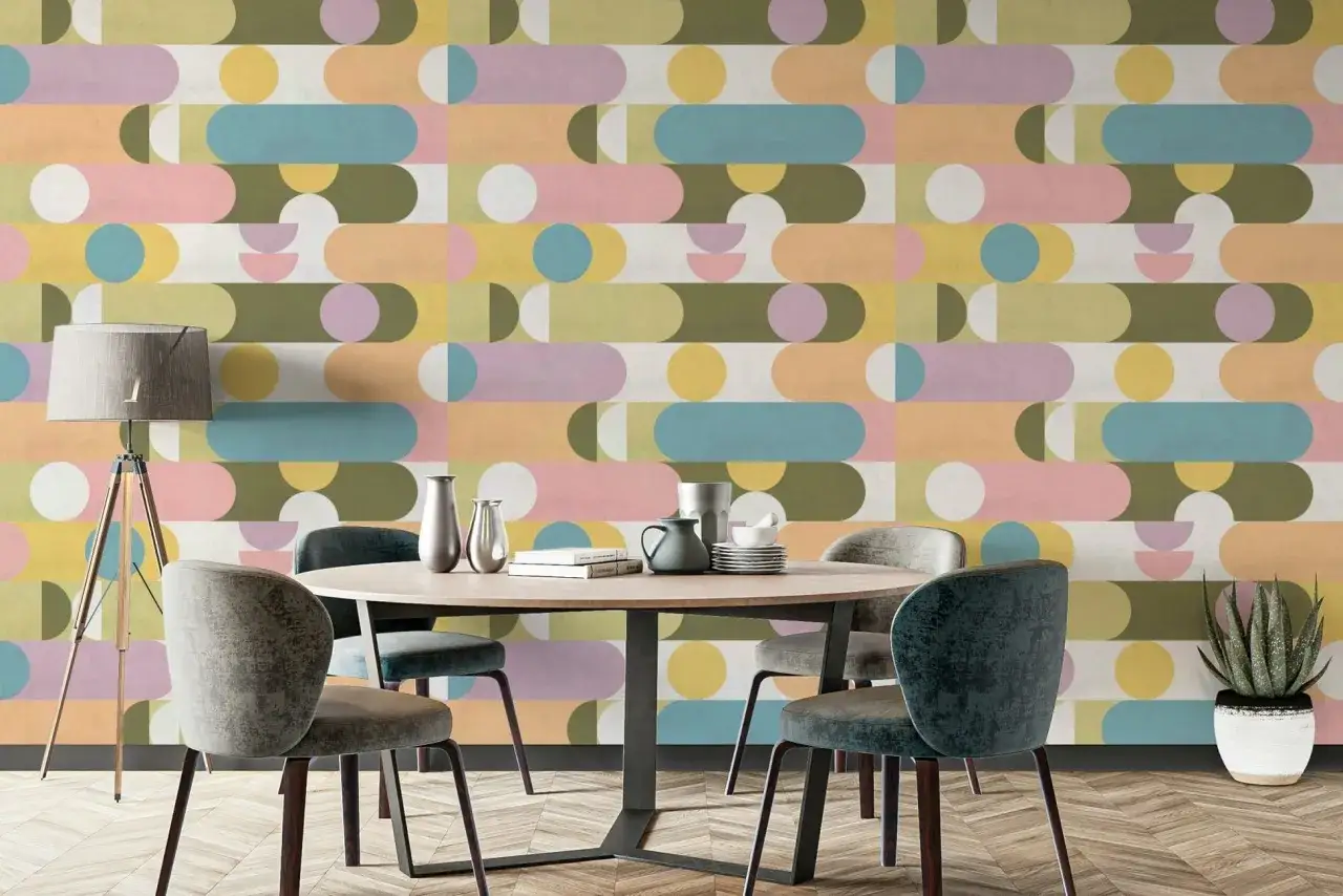 Pared con un patr&oacute;n geom&eacute;trico de formas redondeadas y c&iacute;rculos en tonos pastel, como si fueran bloques de construcci&oacute;n de colores.