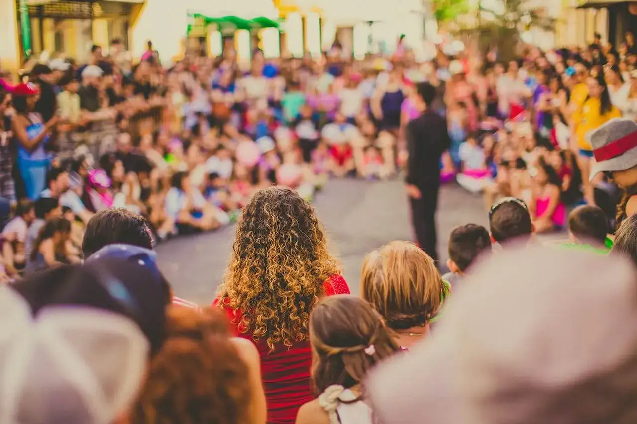 A crowd gathers for a community event, showcasing creative fundraising ideas for a nonprofit.
