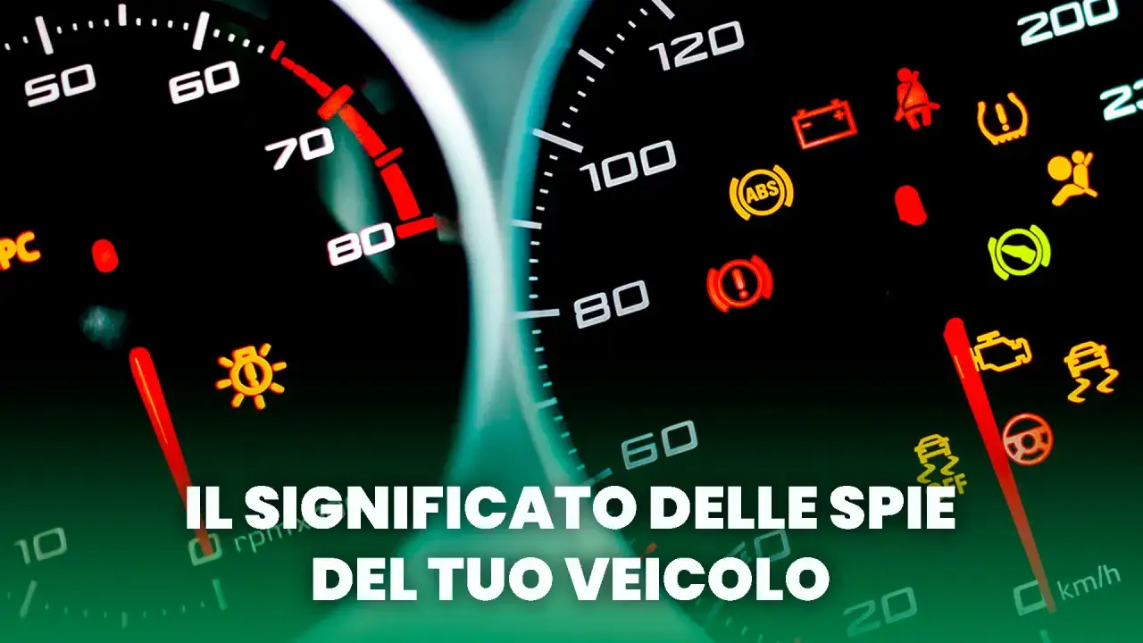 Cruscotto con spie accese, tra cui ABS e controllo stabilità. Una foto spia che illustra i segnali del veicolo.