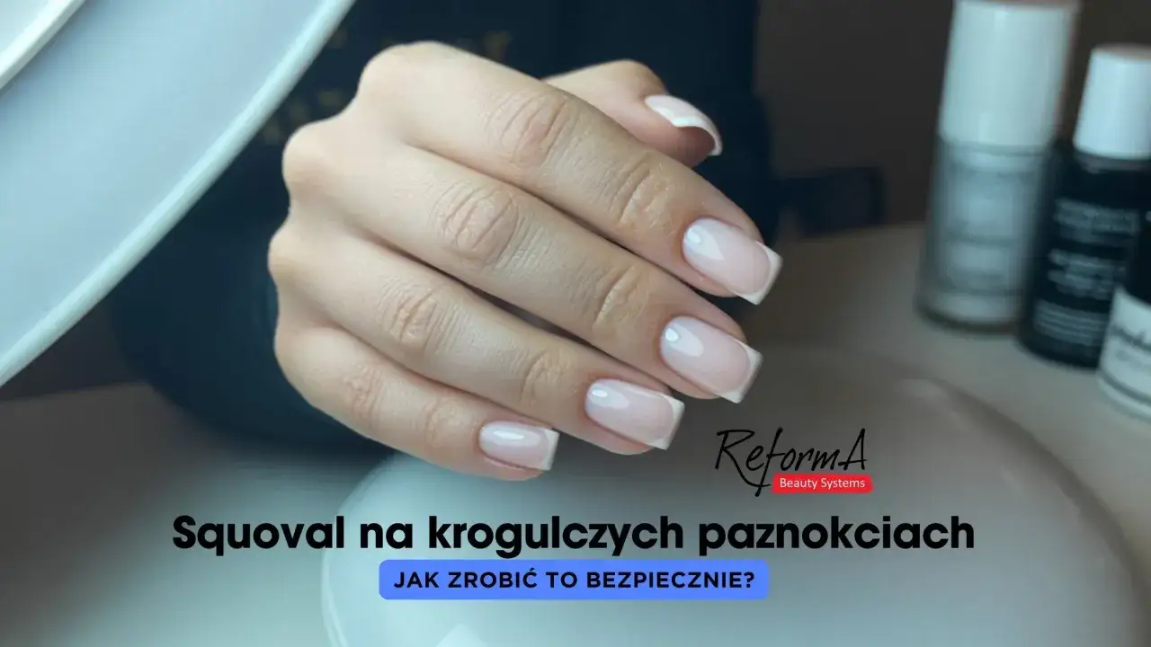 Eleganckie **squoval paznokcie** z delikatnym frenchem. Dłonie prezentują się nienagannie, podkreślając profesjonalizm stylizacji.