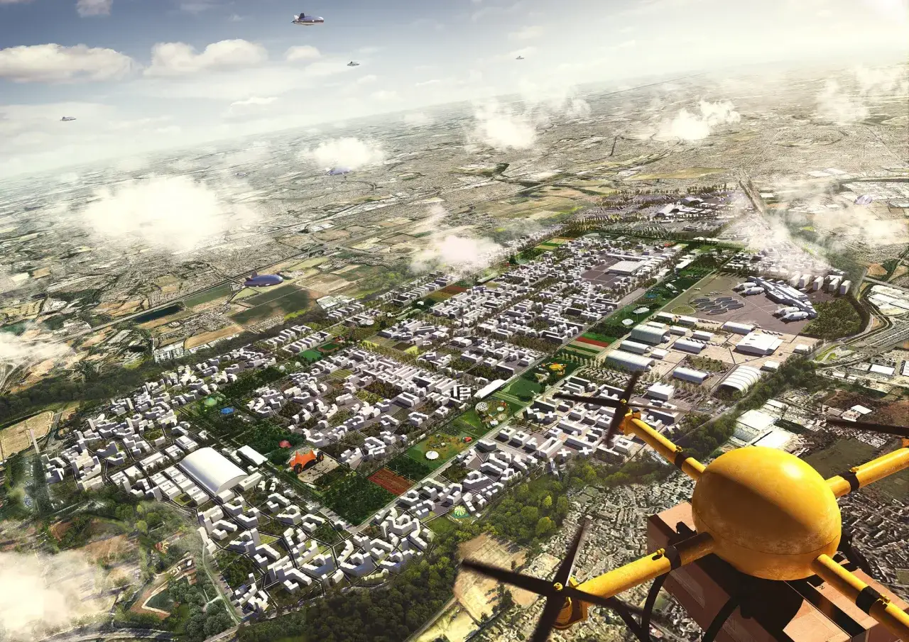 Vue aérienne d'une ville futuriste, vue par un drone. Des bâtiments modernes, des espaces verts et des infrastructures s'étendent à perte de vue.