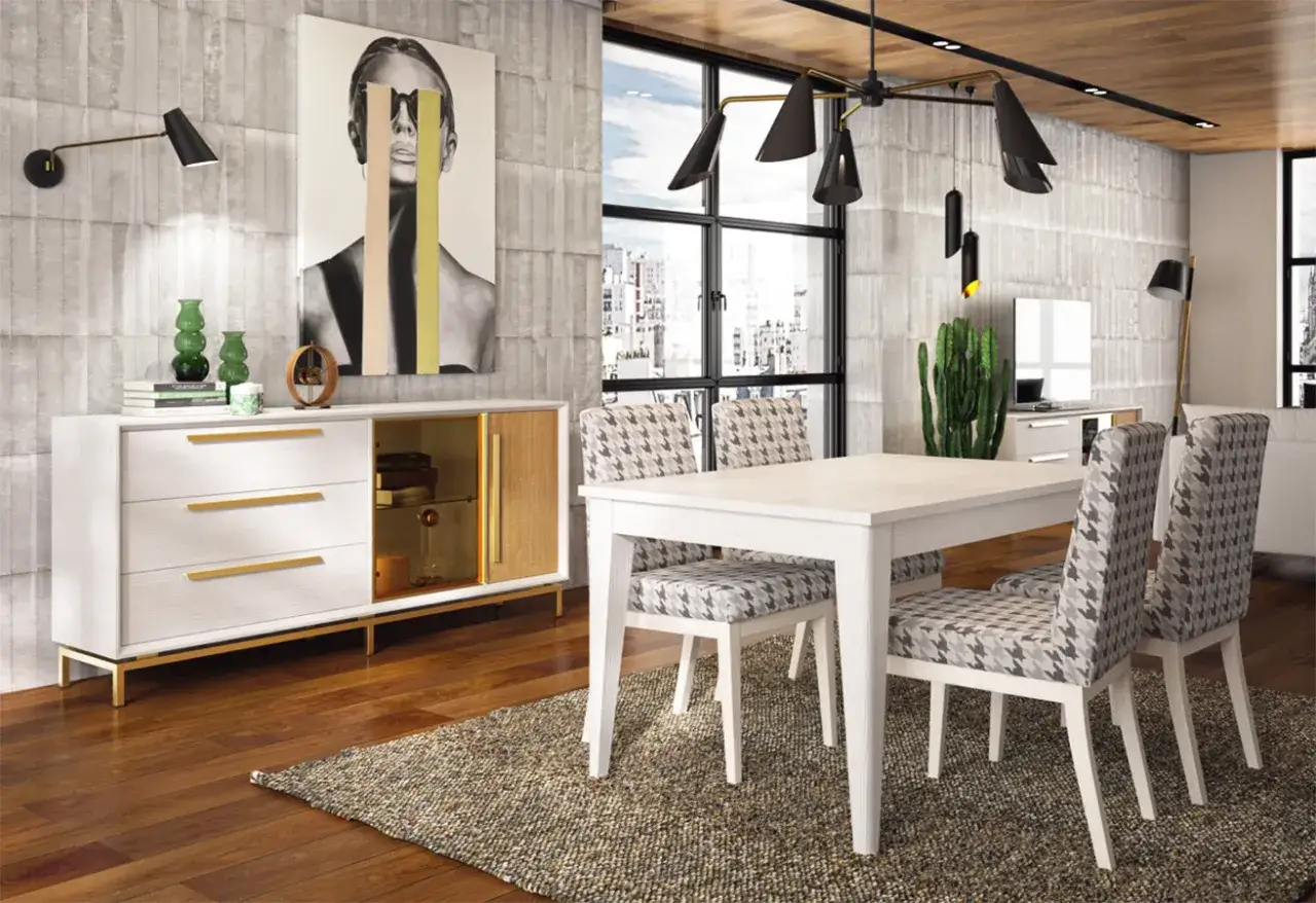 Comedor moderno con mesa y sillas tapizadas, aparador de muebles pintados en blanco y madera, y arte abstracto en la pared.