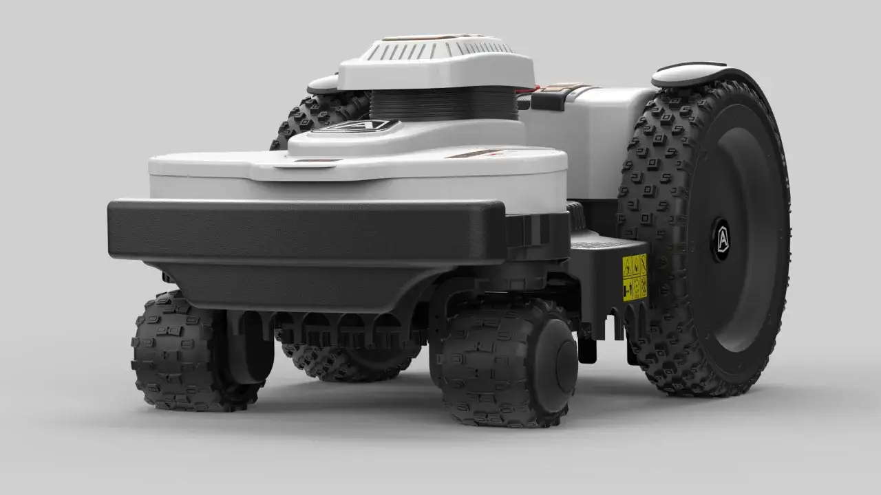 Robot koszący na trudny teren, z dużymi, terenowymi kołami, gotowy do pracy na nierównościach.