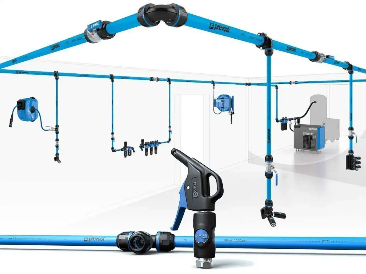 Sistema de instalaciones de aire comprimido Prevost, con tuber&iacute;as azules, enrolladores y pistola de soplado.