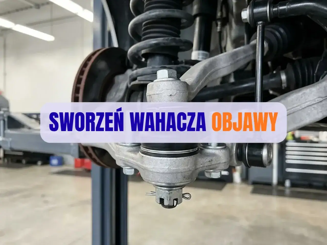 Widok na sworzeń wahacza w samochodzie. Element zawieszenia, który może wymagać wymiany.