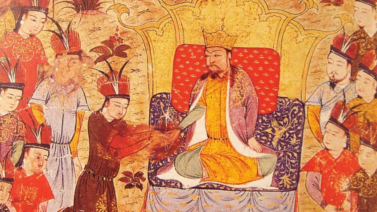 Gengis Khan, assis sur son tr&ocirc;ne, re&ccedil;oit un tribut. Sa fortune, symbolis&eacute;e par l'abondance de ses v&ecirc;tements et la richesse de la sc&egrave;ne, est &eacute;vidente.