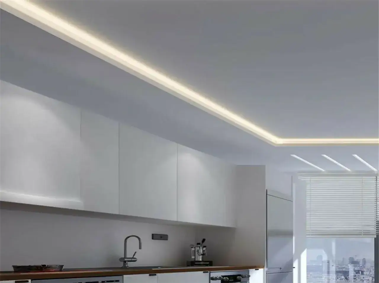 Illuminazione a led integrata in un controsoffitto in cartongesso per la cucina, creando un'atmosfera moderna e accogliente.