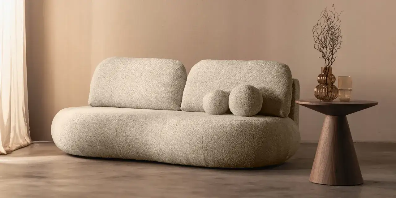 nowoczesna sofa obłe kształty boucle