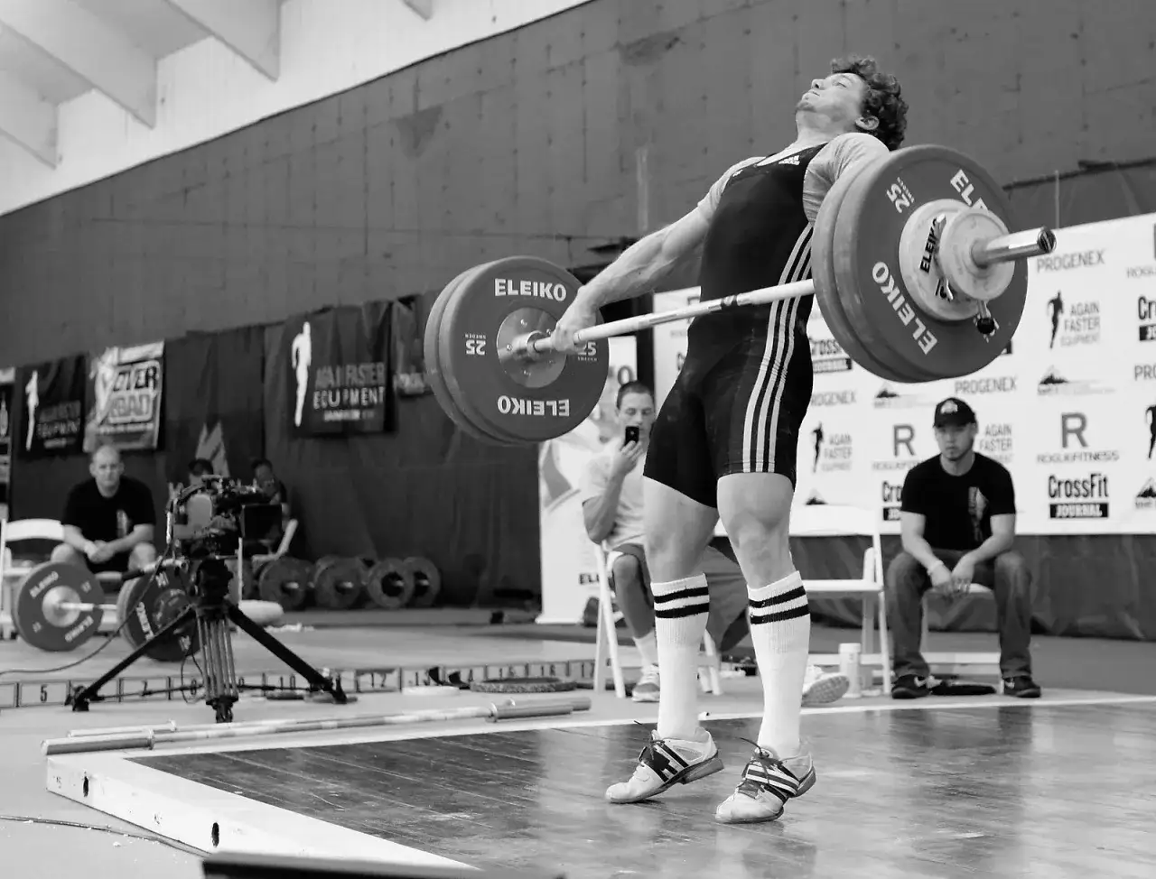 Athlete performing a powerful lift, showcasing explosive strength. This image captures the intensity of workouts for explosiveness.