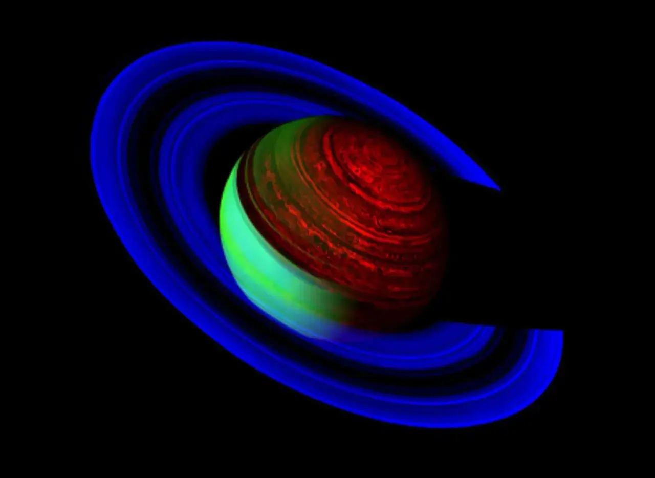 Saturnus ringar i bl&aring;tt omger en planet med r&ouml;tt och gr&ouml;nt som visar saturnus temperatur nattsida.