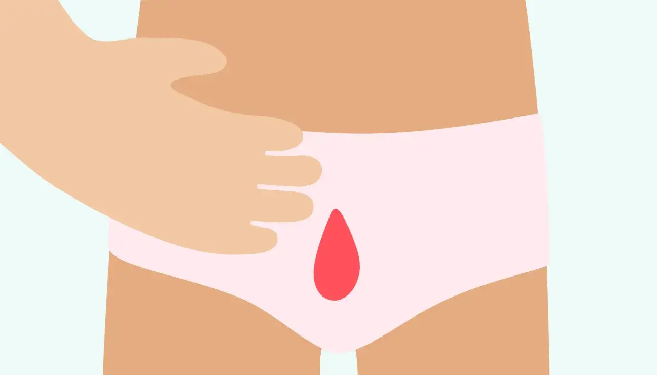 Une main touche une culotte rose avec une goutte de sang. Illustration d'un saignement de grossesse.