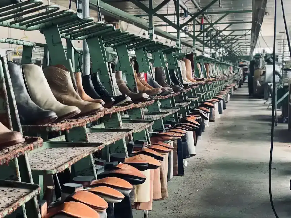 Rows of boots on a factory line. This is where Hanwag boots are made, showcasing the craftsmanship.