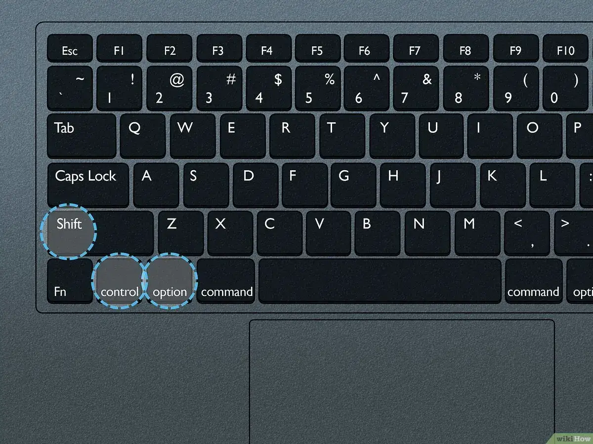 Klawiatura z podświetlonymi klawiszami Shift, Control, Option i Command. Dowiedz się, jak zrestartować laptopa.