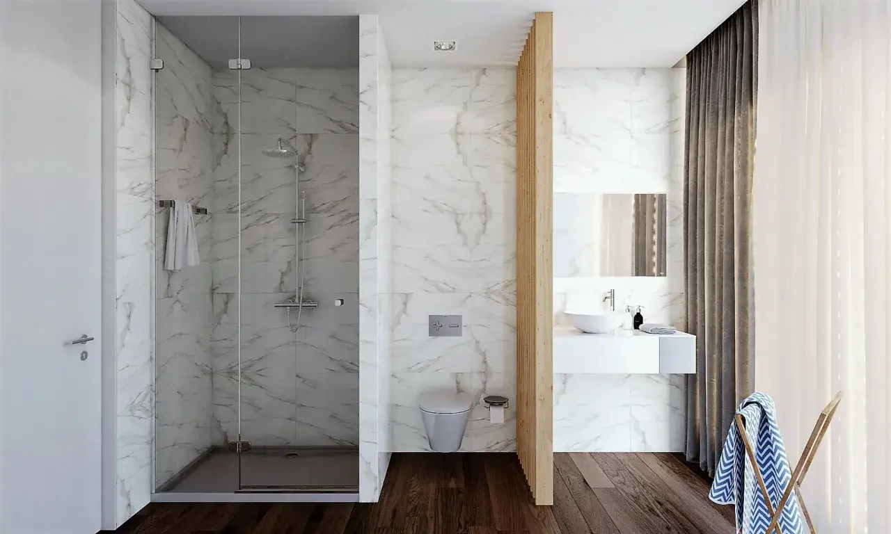 Ba&ntilde;o moderno con ducha de suelo continuo, lavabo flotante y cortinas elegantes.