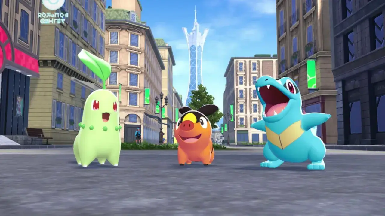 Tres Pokémon iniciales de la región de Paldea, Sprigatito, Fuecoco y Quaxly, posan en una calle de la ciudad, listos para la aventura en Pokémon ZA.