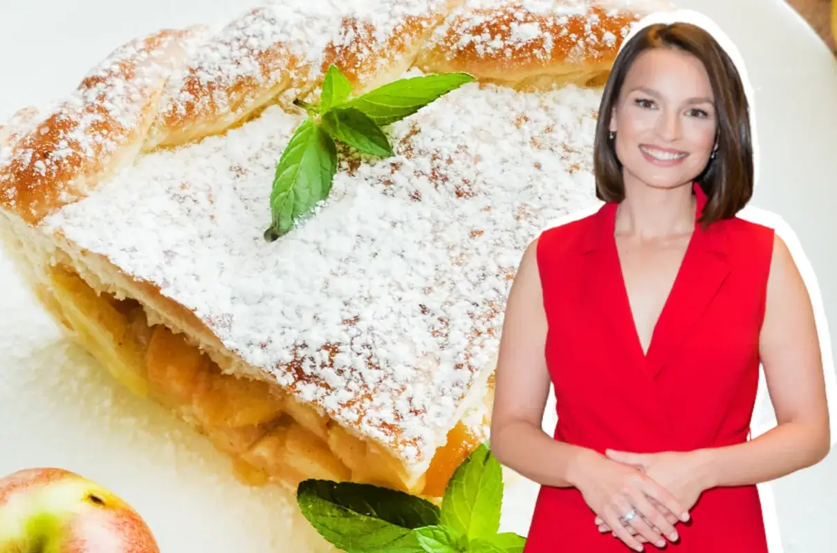 Ania Starmach prezentuje pyszną szarlotkę, posypaną cukrem pudrem i udekorowaną miętą.