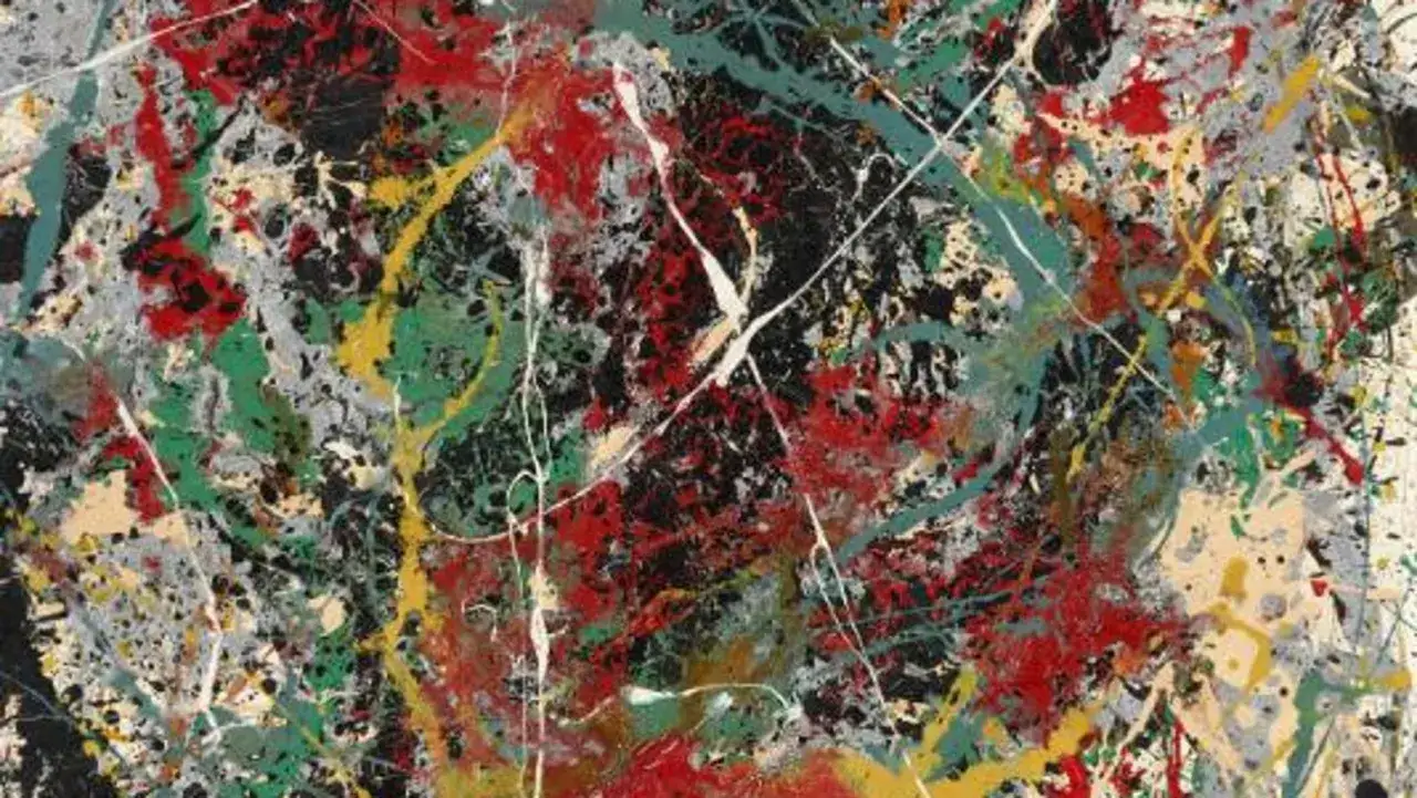 A Jackson Pollock painting worth $140 million, featuring a chaotic yet vibrant drip painting with splashes of red, green, yellow, and white on a dark background.