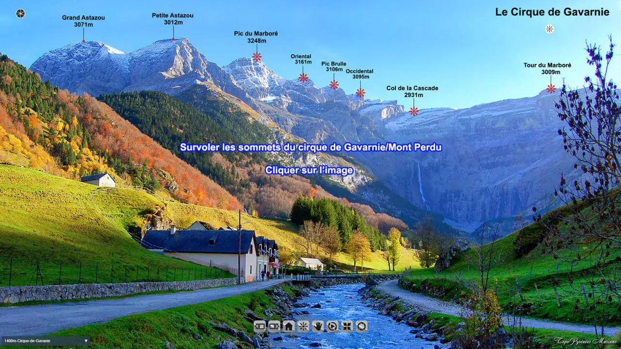 Vue panoramique du **cirque de Gavarnie** avec ses sommets enneig&eacute;s, ses pentes verdoyantes et une cascade. Un village est nich&eacute; au pied des montagnes.