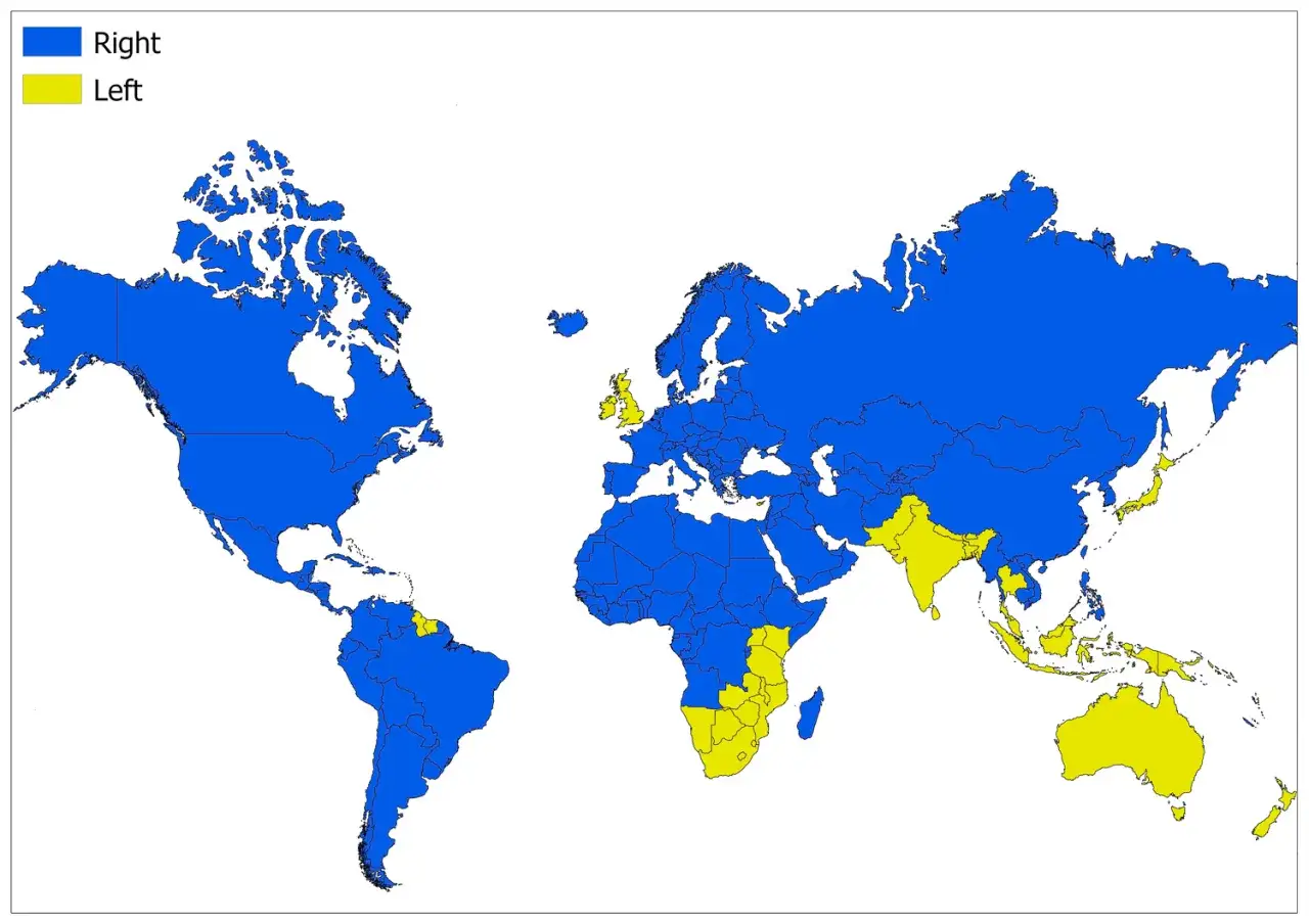 Mappa del mondo che mostra i paesi con guida a sinistra (giallo) e a destra (blu).