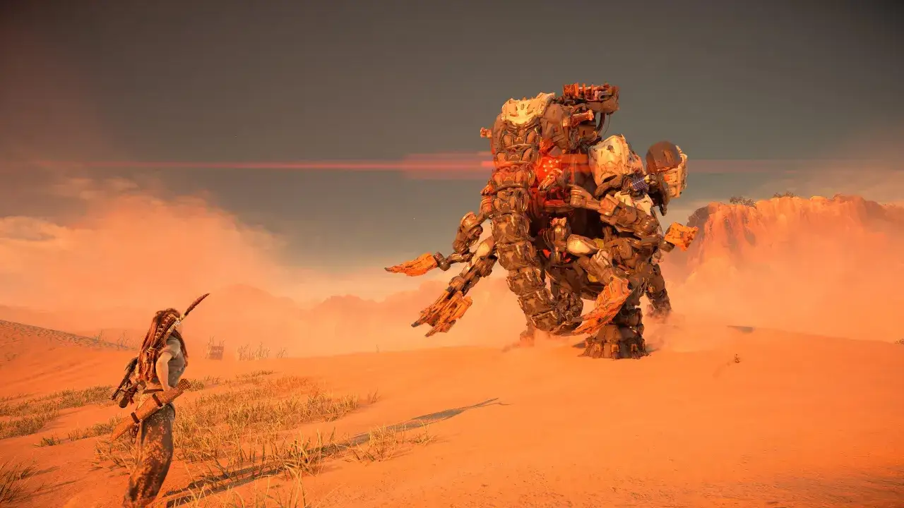 Aloy walczy z mechanicznym potworem na pustyni. To scena z gry Horizon Zero Dawn, gdzie zdobycie platyny wymaga pokonania wielu wyzwań.