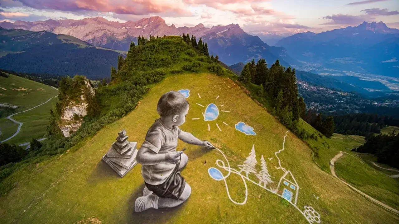 Un enfant dessine un paysage idyllique sur une colline, une œuvre de land art spectaculaire avec des montagnes en arrière-plan.