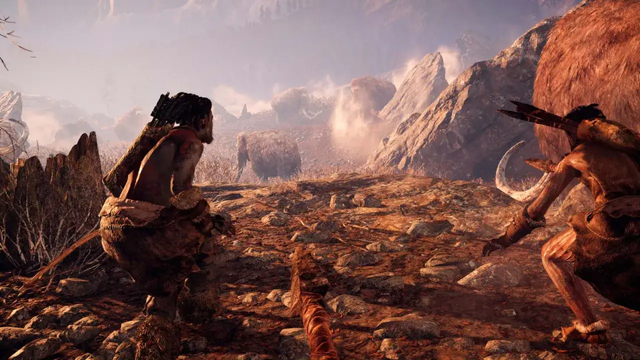 Dwóch wojowników z epoki kamienia, w tym jeden z łukiem, przygotowuje się do polowania na mamuta w świecie Far Cry Primal.