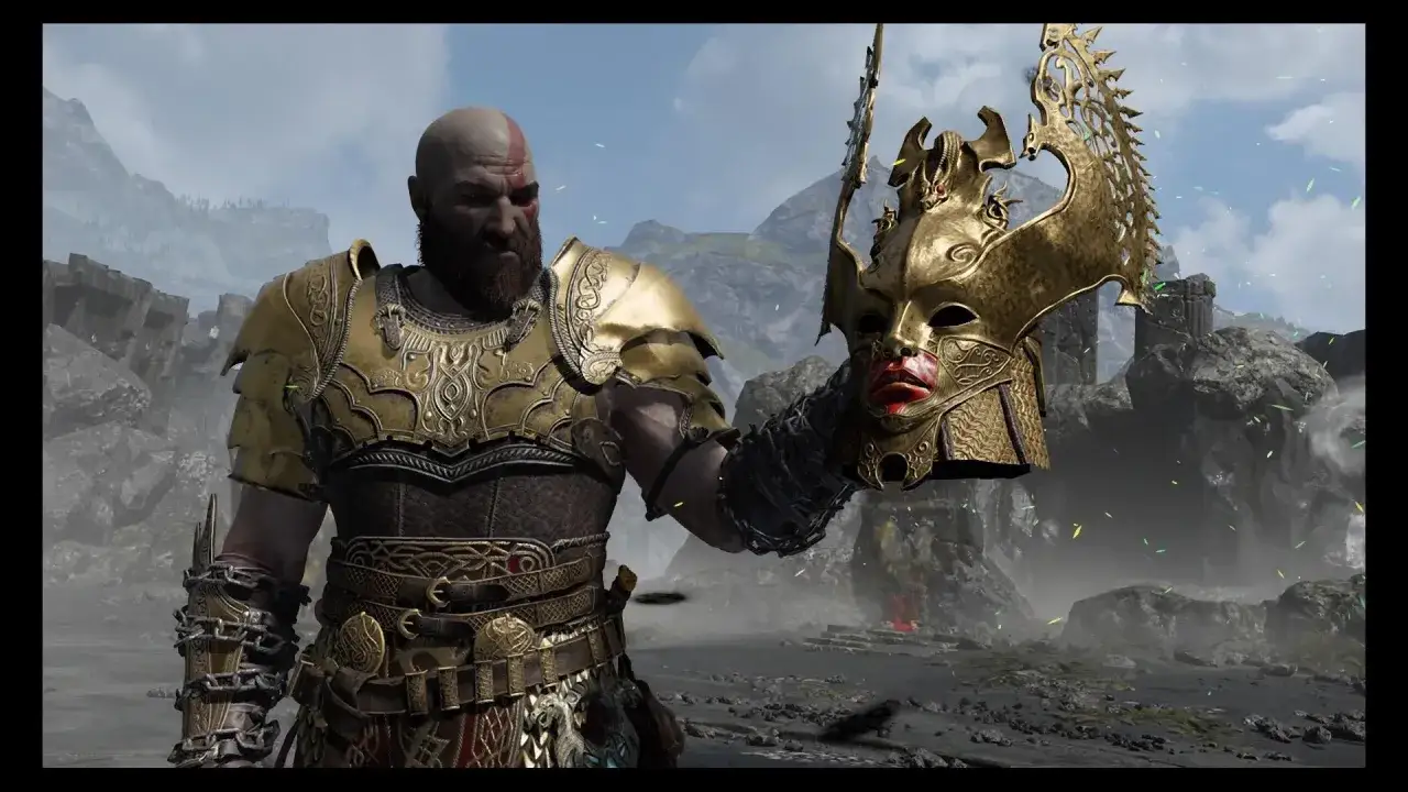 Kratos, el dios de la guerra, sostiene la m&aacute;scara de una valquiria.