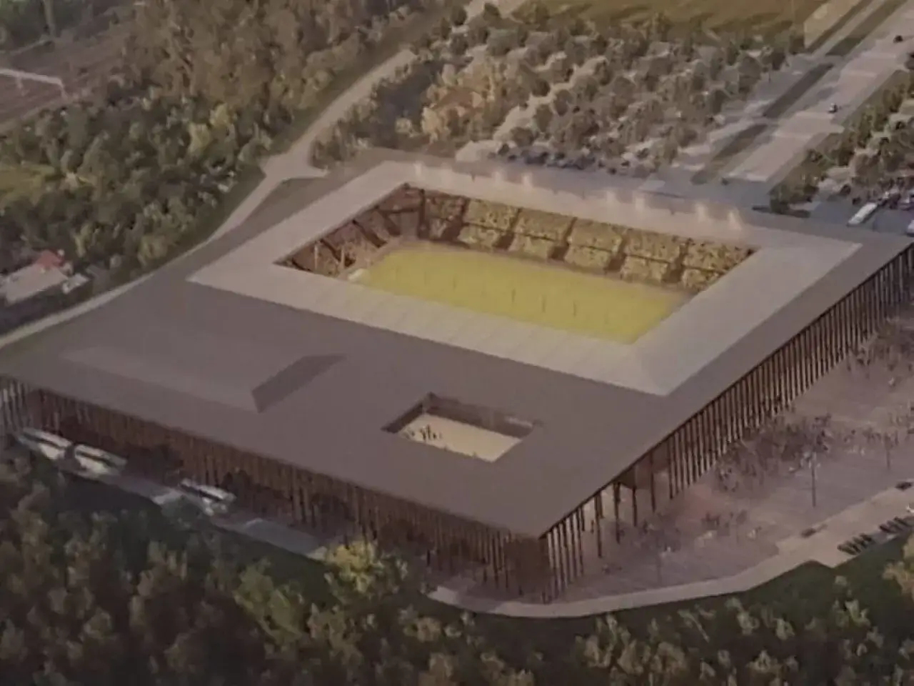Wizualizacja nowego stadionu GKS Katowice. Nowoczesna bryła, trybuny gotowe na kibiców, boisko lśni zielenią.