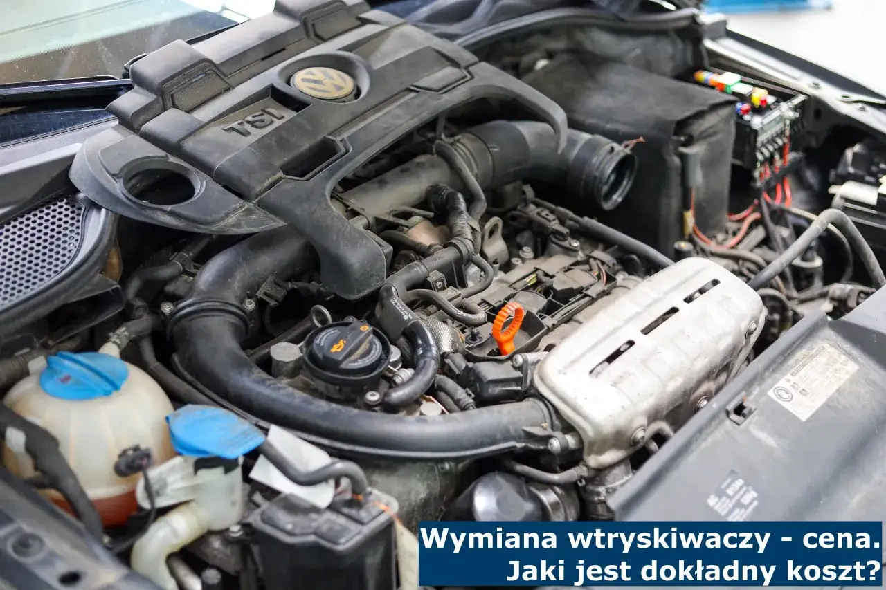 Silnik diesla z widocznymi elementami, w tym pokrywą zaworów. Pytanie brzmi: ile kosztuje wymiana wtryskiwaczy w dieslu?
