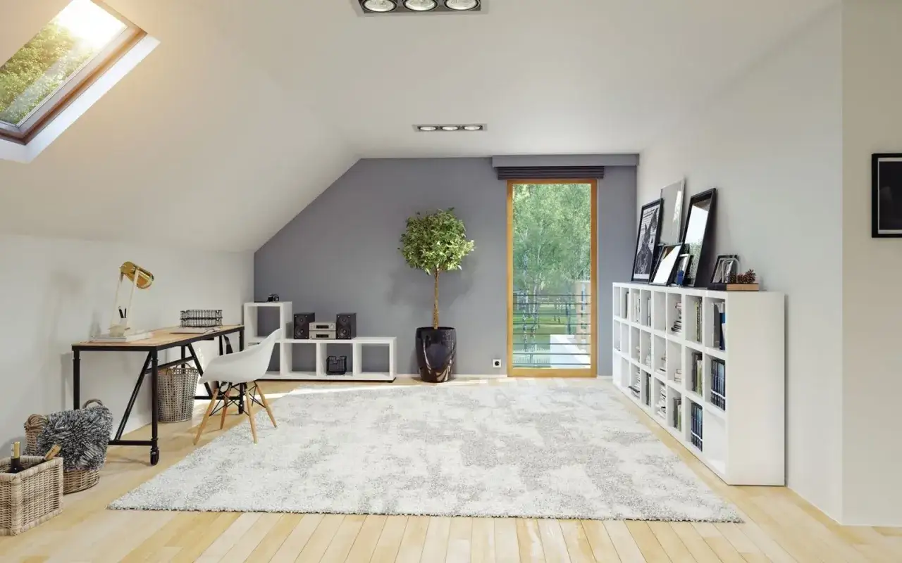 Un ufficio luminoso e accogliente in mansarda, con scrivania, libreria e un grande tappeto soffice. Queste mansarde da sogno invitano al relax e alla creativit&agrave;.