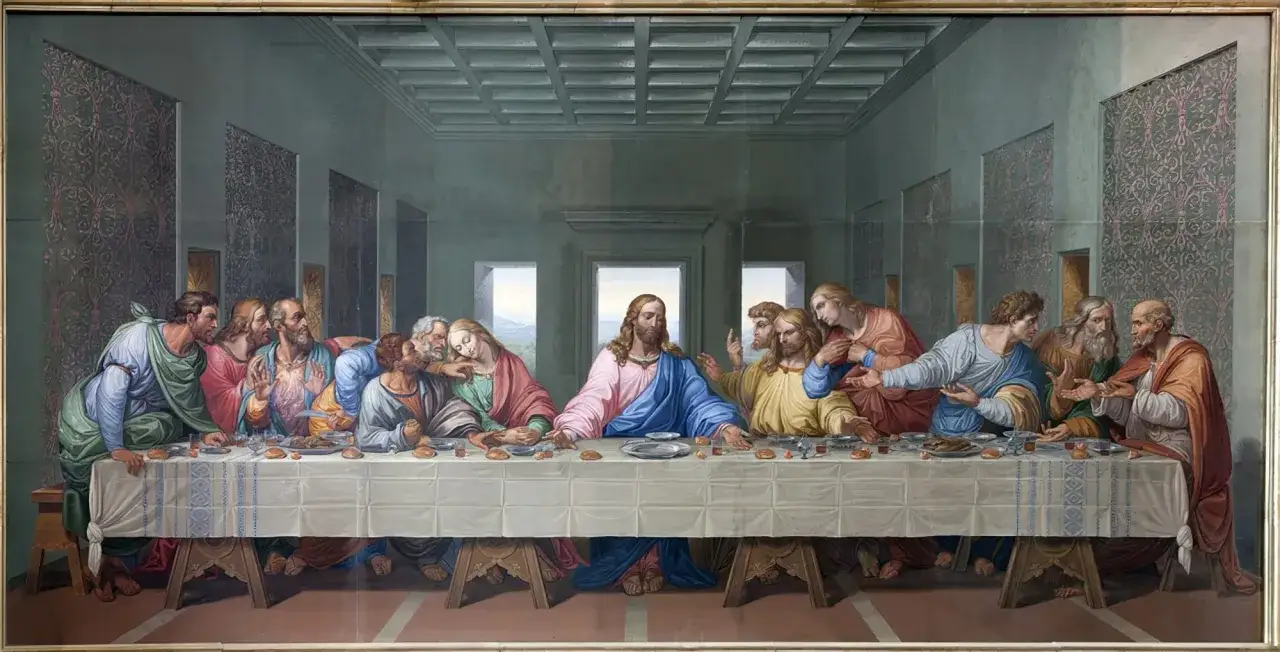 La C&egrave;ne de Vinci : J&eacute;sus au centre, entour&eacute; de ses ap&ocirc;tres, partageant un dernier repas. Les &eacute;motions varient, de la surprise &agrave; la tristesse.