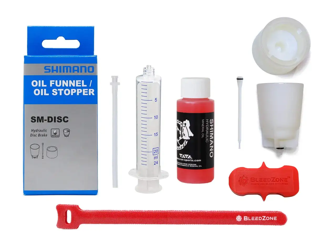 Shimano disc brake bleed kit with oil, syringe, funnel, and stopper. This kit makes it easy to bleed brakes.