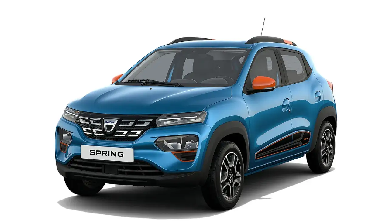 Niebieski Dacia Spring electric z pomarańczowymi akcentami, gotowy na miejskie przygody.