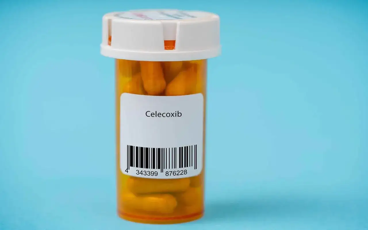 Orange pill bottle with a white cap, labeled
