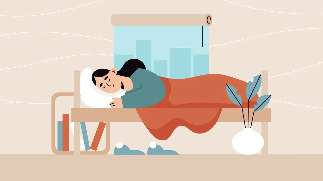 Una persona duerme pl&aacute;cidamente, envuelta en una manta naranja. La escena ilustra la importancia del descanso para recargar energ&iacute;as.