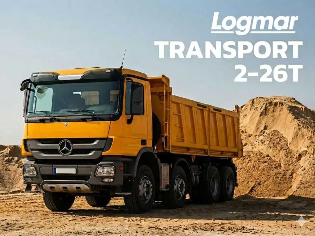 Żółta wywrotka Logmar Transport 2-26T na budowie. Dowiedz się, ile kosztuje tona kruszywa.