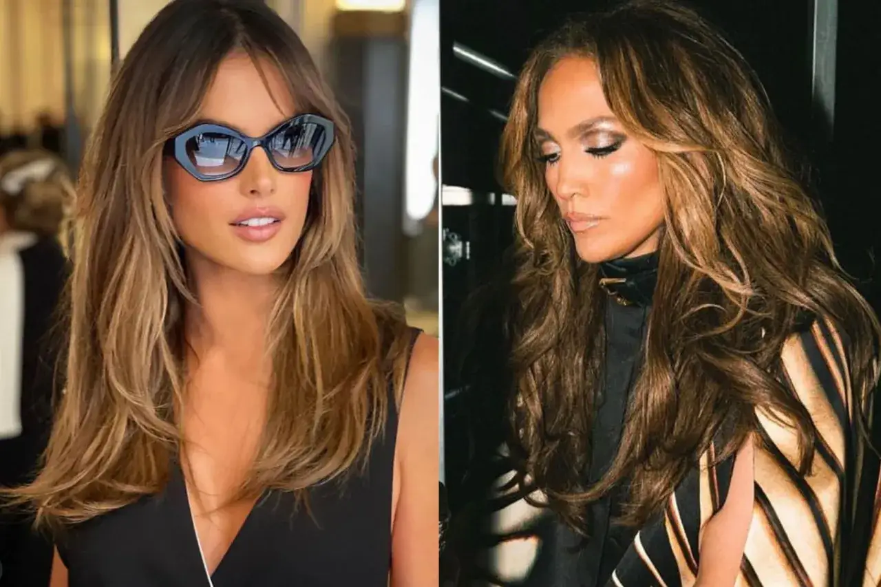 Capelli lunghi e mossi, con riflessi dorati che catturano la luce del sole estivo.