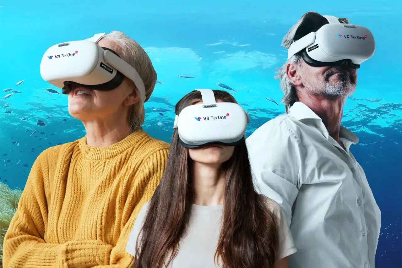 Trzy osoby w goglach VR TierOne zanurzają się w wirtualnym świecie podwodnym. To pokazuje, vr tube co to jest – portal do innych rzeczywistości.
