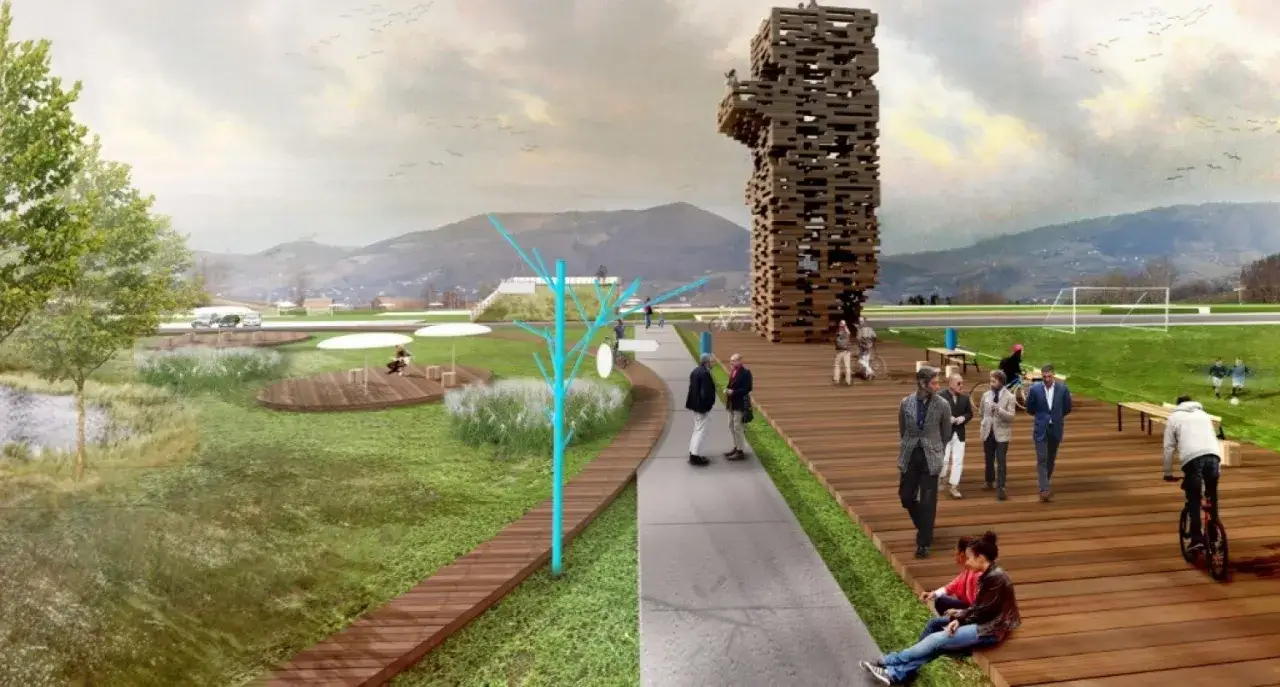 Nowy Sącz atrakcje: nowoczesny park z wieżą widokową, placem zabaw, boiskiem i terenami rekreacyjnymi nad wodą.