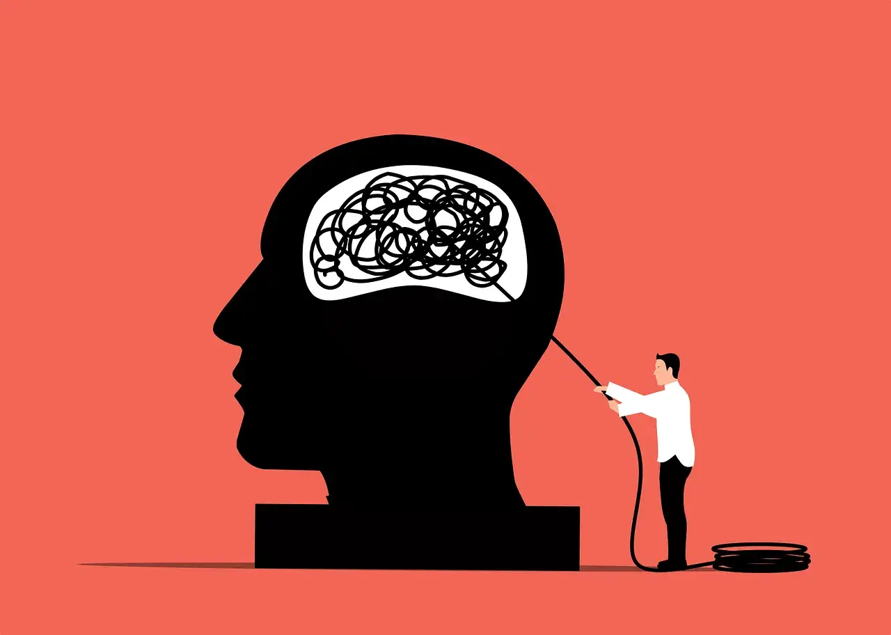 Uomo che districa pensieri aggrovigliati nella testa di un gigante. Simboleggia la terapia breve strategica pro e contro.