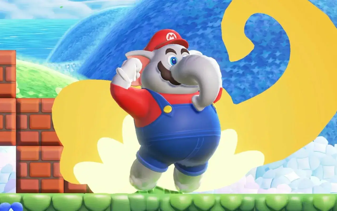 Słoń Mario w niebieskich ogrodniczkach i czerwonej czapce z literą 