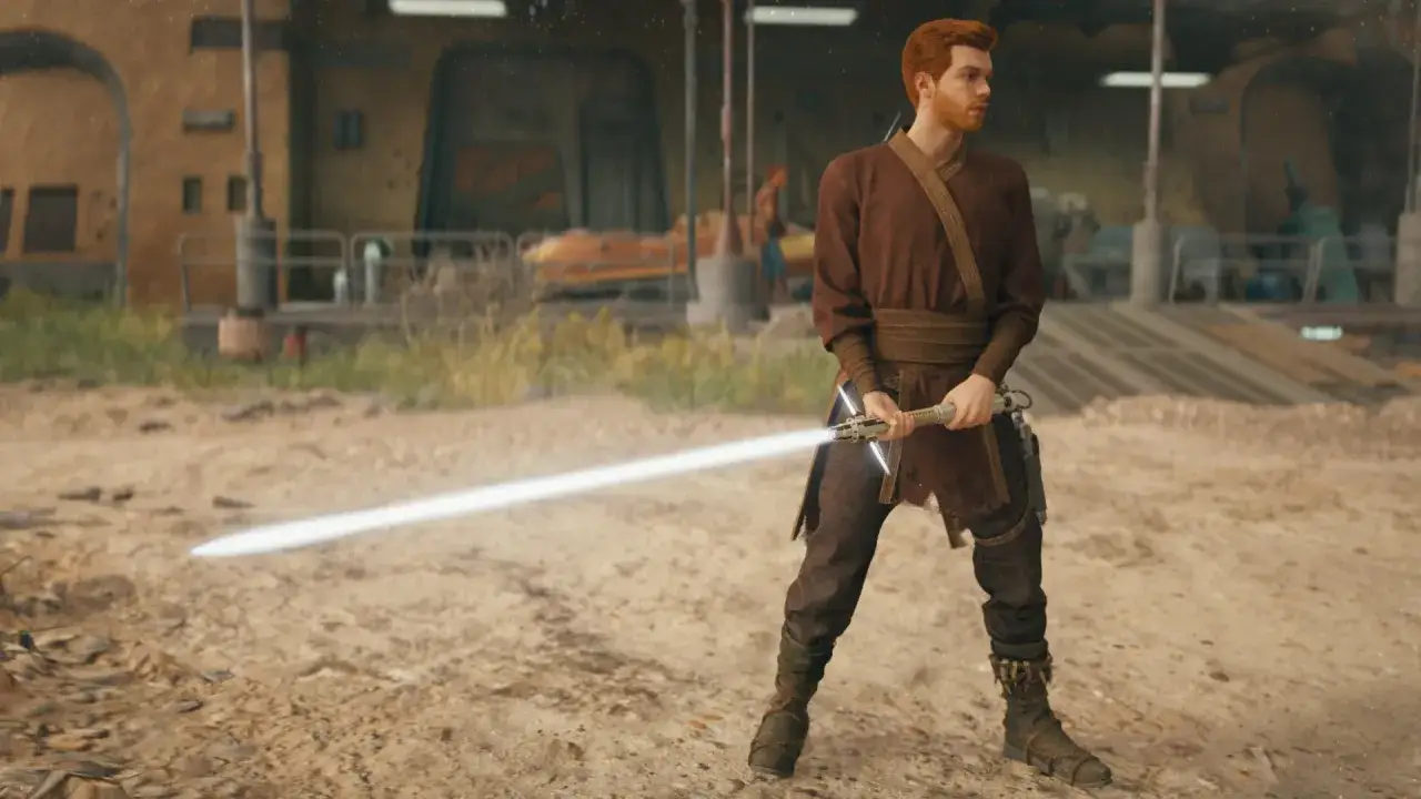 Cal Kestis z mieczem świetlnym w ręku. Wskazówki do Jedi Survivor poradnik.