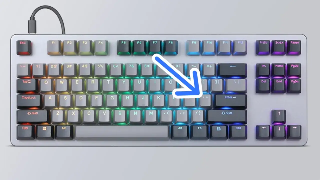 Teclado RGB con flecha azul apuntando a la tecla Enter. Ideal para introducir códigos en Fallout 4.