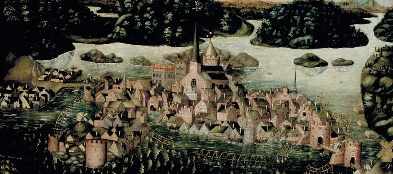 En historisk målning som skildrar en stad vid vattnet med många hus, kyrkor och befästningar. En vy som ger en inblick i stockholms historia.
