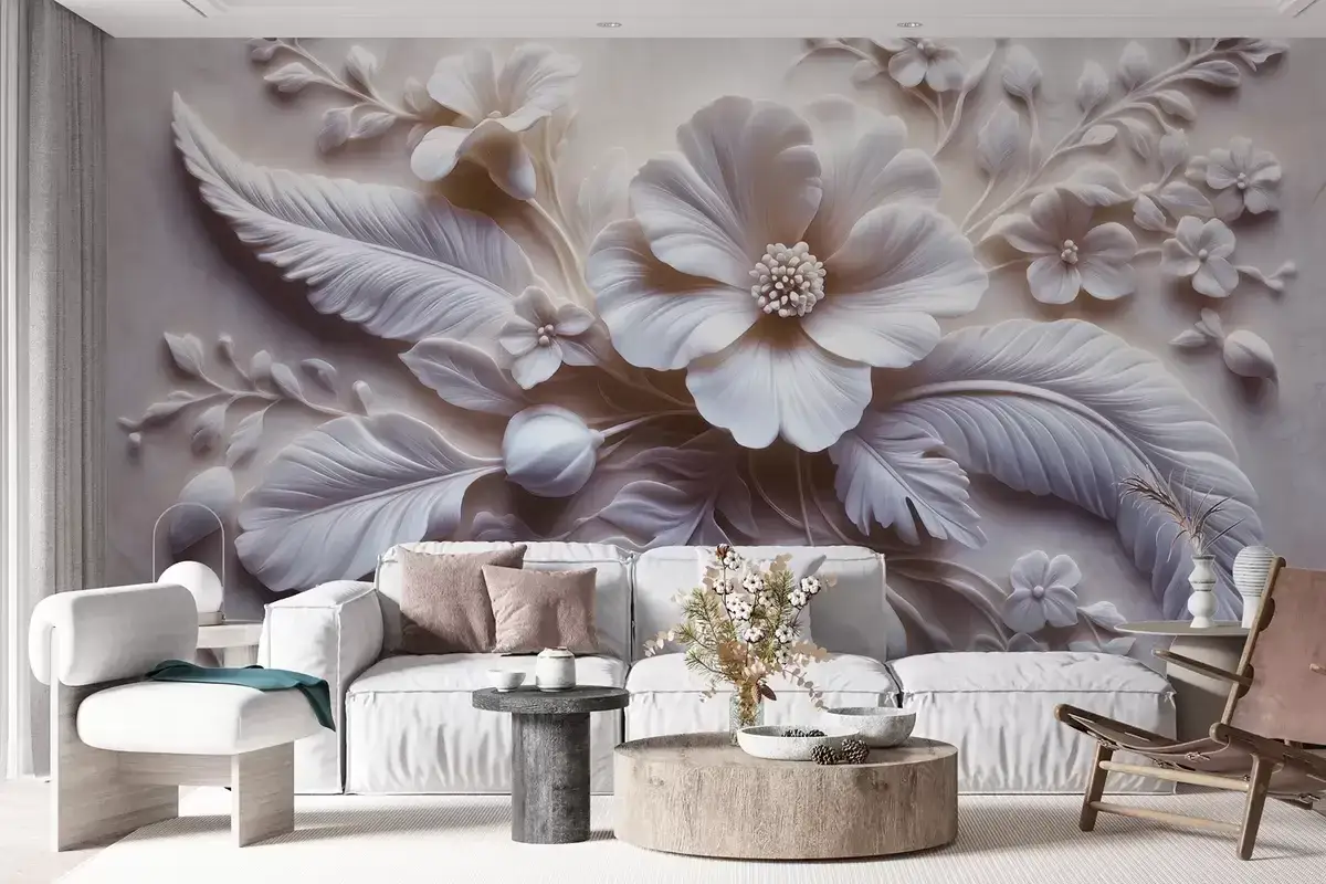 Un papier peint en relief aux fleurs blanches et feuilles, comme si l'on pouvait peindre sur cette texture d&eacute;licate.
